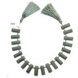 Green cat's eye faceted bead size 7X18-6.5X18mm.