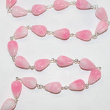 pink opal teardrop birthstone month October, zodiac sign Gemini and Aquarius.