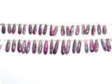 Pink Ruby Zoisite pear birthstone month july zodiac sign leo, gemini, scorpio, sagittarius, and cancer.
