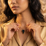 Woman wearing Black Druzy Arrowhead Pendant Necklace on 
chest — Gothic Jewelry Handmade 24K Gold Electroplated 
Statement Necklace styled as everyday wearable jewelry